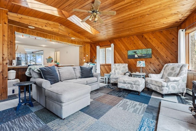 111 Rolphs Point Dr, Shell Lake, WI 54871 - living area featuring plenty of natural light, vaulted ceiling, wood ceiling, a ceiling fan, and wood walls