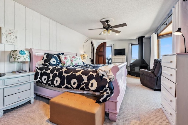 111 Rolphs Point Dr, Shell Lake, WI 54871 - bedroom featuring light carpet, a textured ceiling, and a ceiling fan