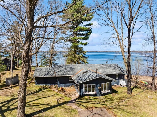 111 Rolphs Point Dr, Shell Lake, WI 54871 - view of front of home featuring a water view and a front lawn
