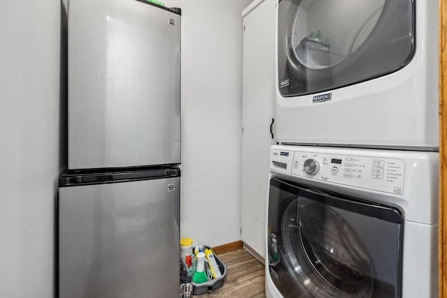 111 Rolphs Point Dr, Shell Lake, WI 54871 - laundry room with stacked washer / dryer, wood finished floors, and baseboards