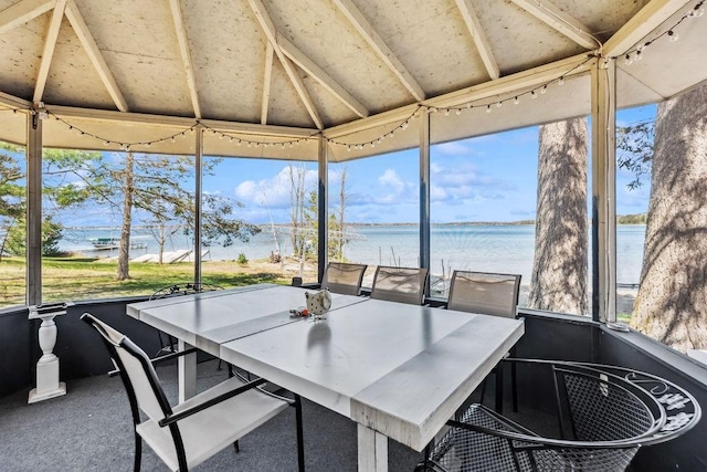 111 Rolphs Point Dr, Shell Lake, WI 54871 - sunroom with vaulted ceiling, a water view, and outdoor dining area