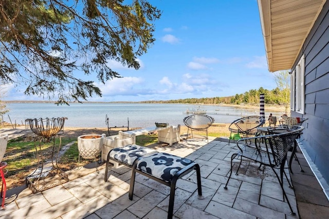 111 Rolphs Point Dr, Shell Lake, WI 54871 - view of patio / terrace featuring a water view