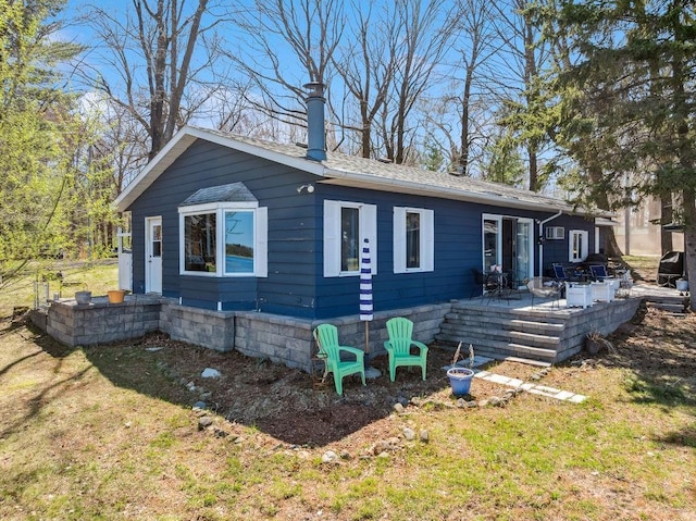 111 Rolphs Point Dr, Shell Lake, WI 54871 - back of house featuring a yard