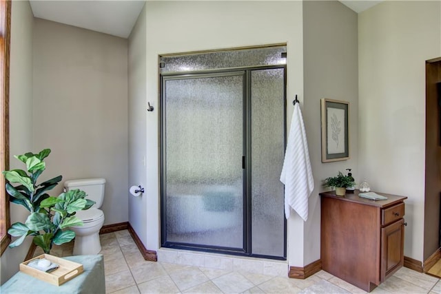 4221 Lassek Ct, Eau Claire, WI 54703 - bathroom featuring toilet, a stall shower, baseboards, and tile patterned flooring