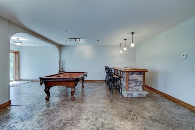 4221 Lassek Ct, Eau Claire, WI 54703 - recreation room with arched walkways, baseboards, bar area, pool table, and track lighting