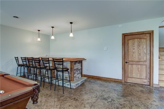 4221 Lassek Ct, Eau Claire, WI 54703 - indoor wet bar featuring baseboards, billiards table, and hanging light fixtures