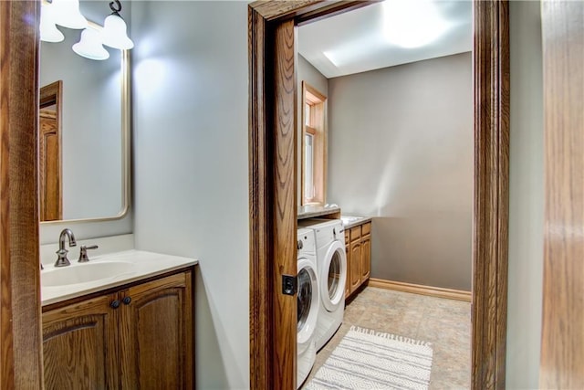 4221 Lassek Ct, Eau Claire, WI 54703 - washroom featuring cabinet space, washing machine and clothes dryer, and baseboards