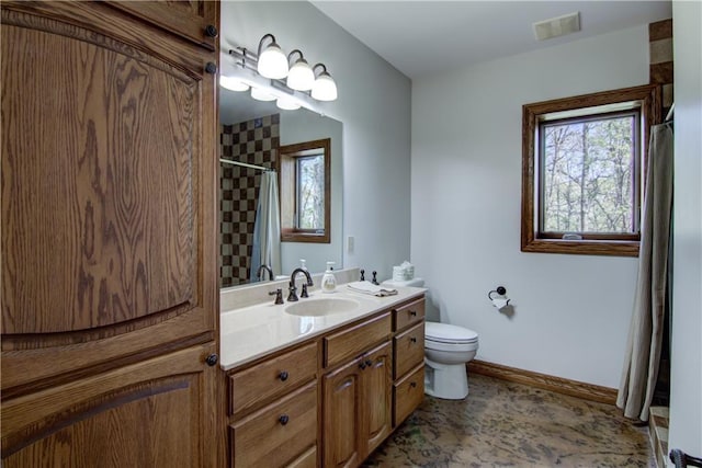 4221 Lassek Ct, Eau Claire, WI 54703 - bathroom with toilet, curtained shower, vanity, and baseboards