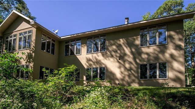 4221 Lassek Ct, Eau Claire, WI 54703 - view of side of home featuring stucco siding