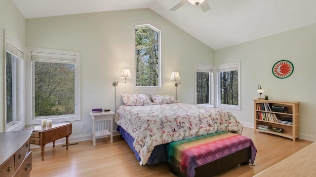 12384 98th St, Chippewa Falls, WI 54729 - bedroom featuring light wood-style floors, vaulted ceiling, a ceiling fan, and baseboards
