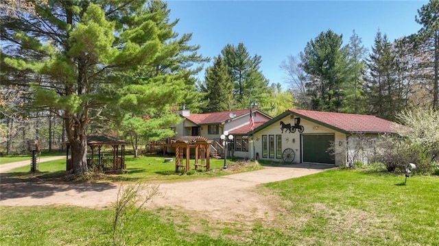 9027 W County Road D, Holcombe, WI 54745 - view of front of home with concrete driveway, a front yard, and a gazebo