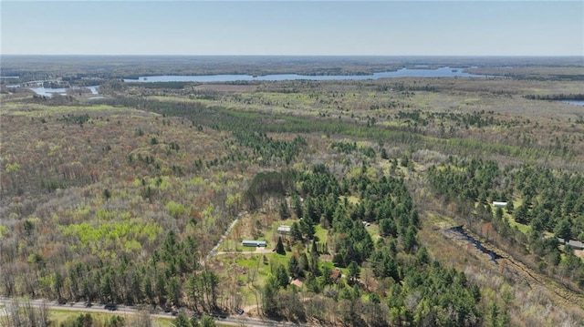 9027 W County Road D, Holcombe, WI 54745 - aerial view of property and surrounding area with a heavily wooded area