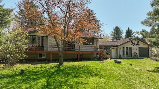 9027 W County Road D, Holcombe, WI 54745 - back of house featuring stairway, a yard, a deck, and an attached garage
