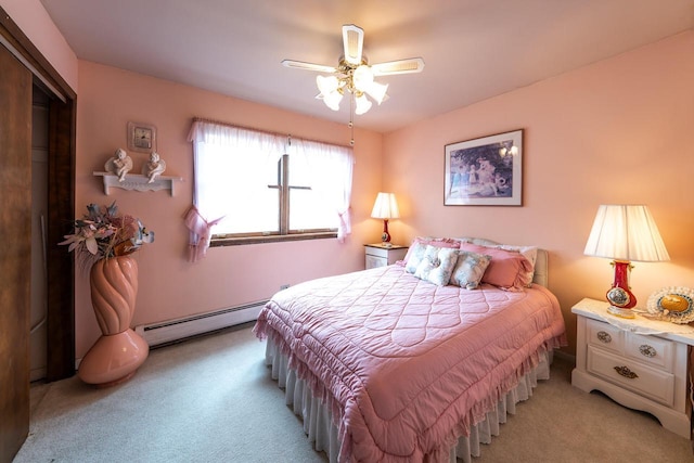 205 Country Club Dr Unit 3D, Lake Geneva, WI 53147 - bedroom featuring baseboard heating, light colored carpet, and ceiling fan