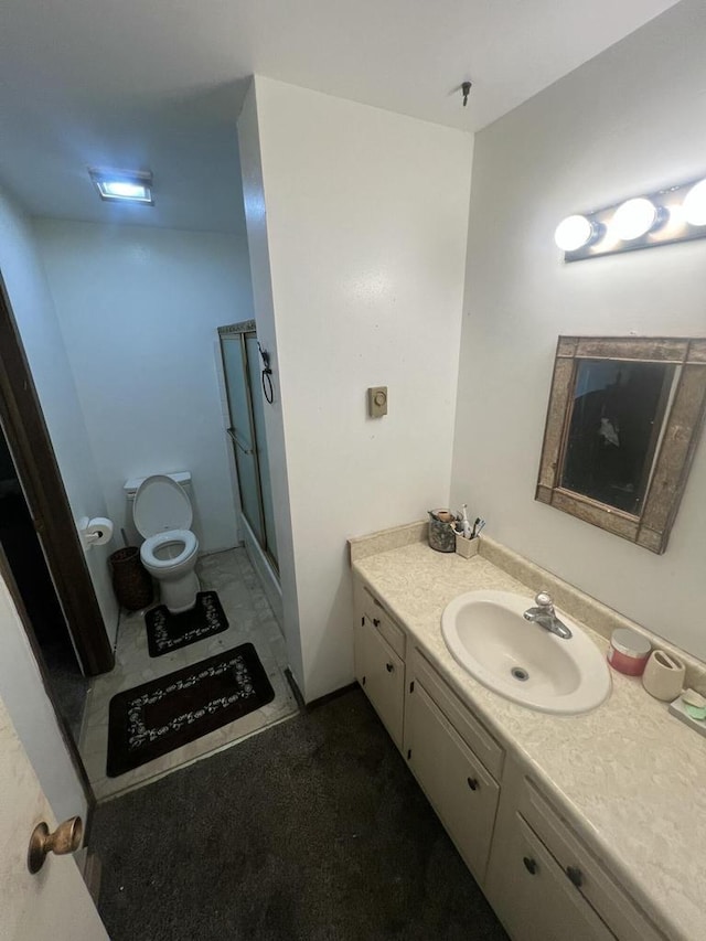 8657 N 73rd St, Milwaukee, WI 53223 - full bathroom featuring vanity, a shower stall, and toilet