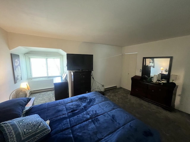 8657 N 73rd St, Milwaukee, WI 53223 - bedroom with dark carpet and a baseboard heating unit