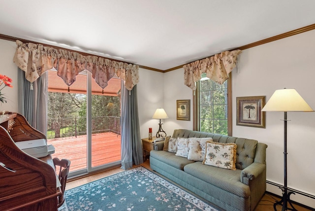 4151 Elmwood Rd, Colgate, WI 53017 - living room featuring baseboard heating, ornamental molding, plenty of natural light, and wood finished floors