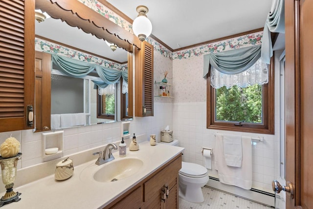 4151 Elmwood Rd, Colgate, WI 53017 - bathroom with a baseboard radiator, wallpapered walls, toilet, healthy amount of natural light, and vanity