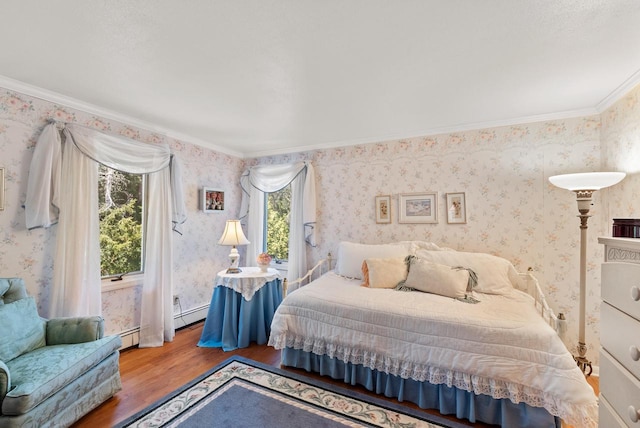 4151 Elmwood Rd, Colgate, WI 53017 - bedroom with wood finished floors, wallpapered walls, ornamental molding, and a baseboard radiator