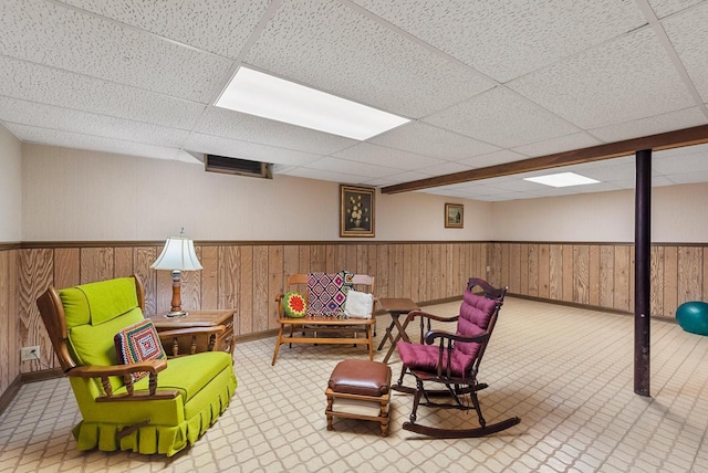 4151 Elmwood Rd, Colgate, WI 53017 - living area featuring a drop ceiling, a wainscoted wall, and wooden walls