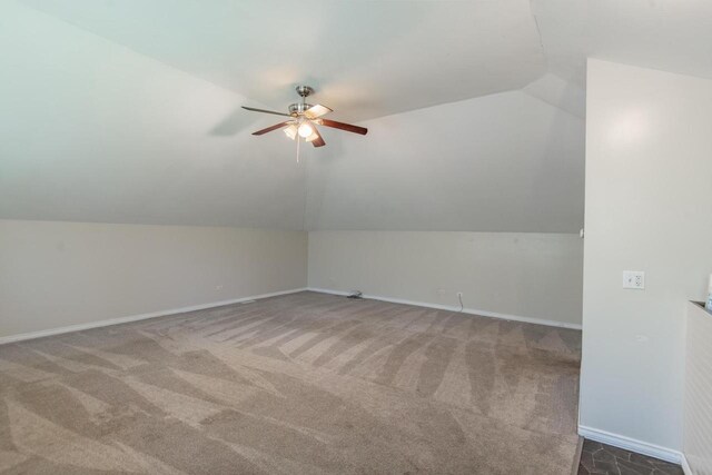 552 11th St, Kenosha, WI 53140 - additional living space with ceiling fan, vaulted ceiling, carpet flooring, and baseboards