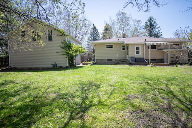 552 11th St, Kenosha, WI 53140 - back of property featuring central AC and a chimney