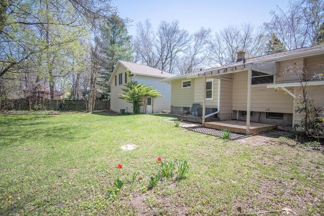 552 11th St, Kenosha, WI 53140 - back of property featuring a wooden deck and a chimney