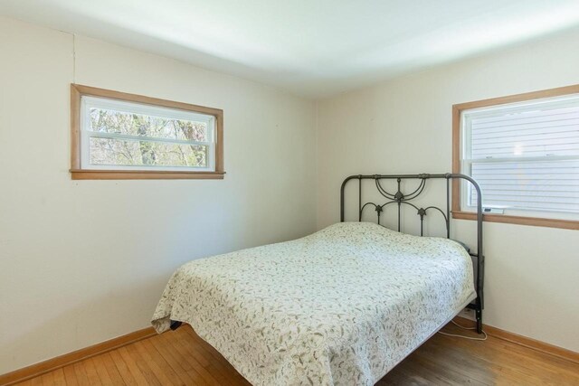 552 11th St, Kenosha, WI 53140 - bedroom with hardwood / wood-style flooring and baseboards