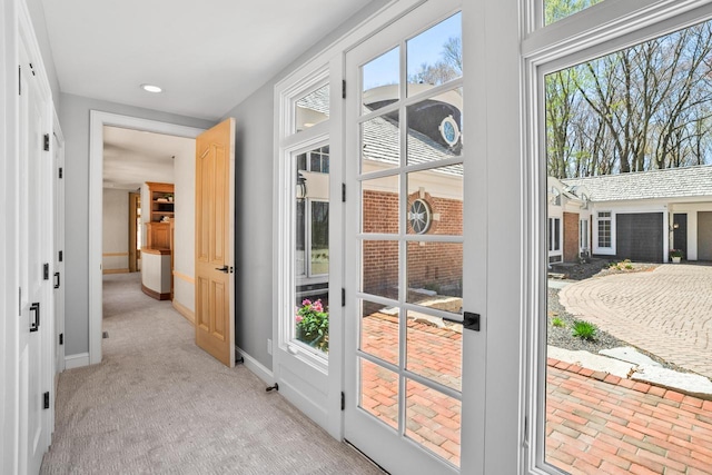 889 Horns Corners Rd, Cedarburg, WI 53012 - doorway featuring baseboards, recessed lighting, healthy amount of natural light, and light colored carpet