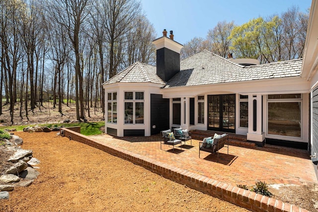 889 Horns Corners Rd, Cedarburg, WI 53012 - back of property with a patio area, a chimney, and outdoor lounge area