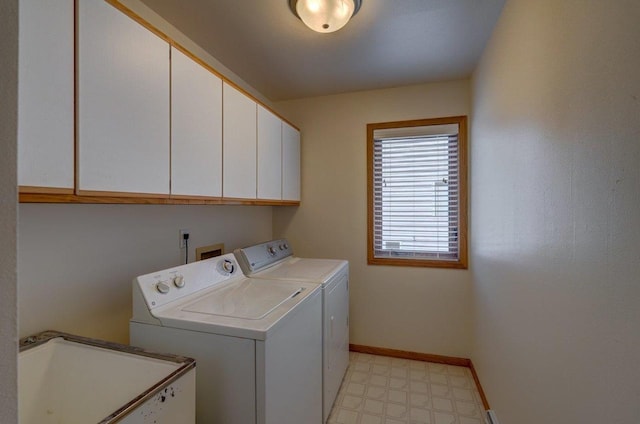 821 Ondossagon Way, Madison, WI 53719 - laundry room with cabinet space, washing machine and clothes dryer, light floors, and baseboards
