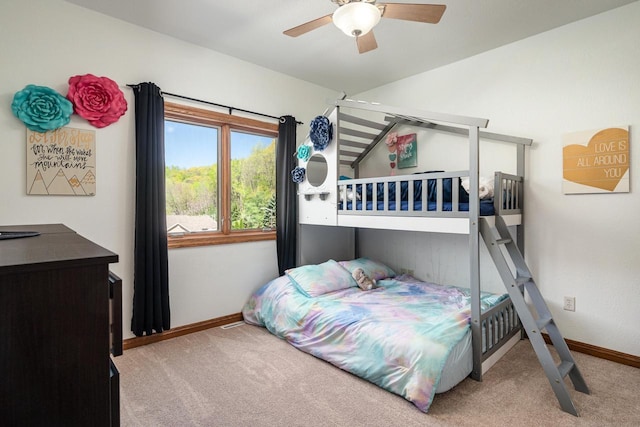 403 14th St, North Street, La Crescent, MN 55947 - carpeted bedroom featuring baseboards, ceiling fan, and vaulted ceiling