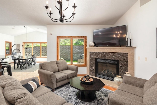 403 14th St, North Street, La Crescent, MN 55947 - living room featuring a chandelier, lofted ceiling, and a fireplace