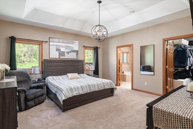 403 14th St, North Street, La Crescent, MN 55947 - bedroom featuring a chandelier, light carpet, a raised ceiling, and a spacious closet