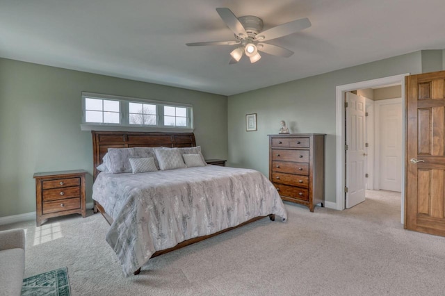 W280N7123 Millpond Way, Hartland, WI 53029 - bedroom with light carpet, baseboards, and ceiling fan