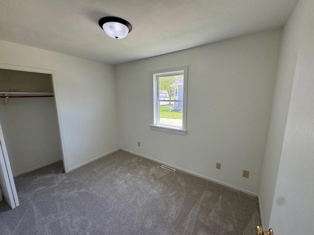 4814 Freese Ln, Madison, WI 53718 - unfurnished bedroom featuring carpet floors, a closet, and baseboards