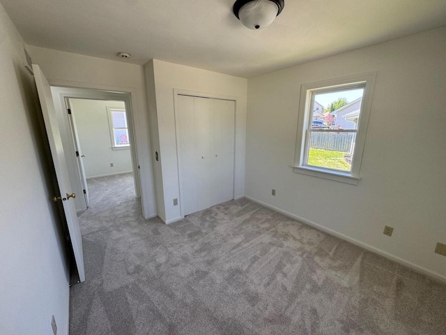 4814 Freese Ln, Madison, WI 53718 - unfurnished bedroom with light colored carpet, baseboards, and a closet