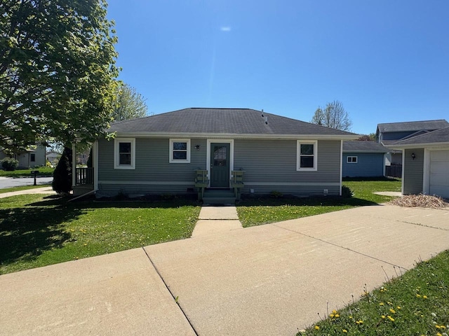 4814 Freese Ln, Madison, WI 53718 - view of front of house with a front lawn and a garage