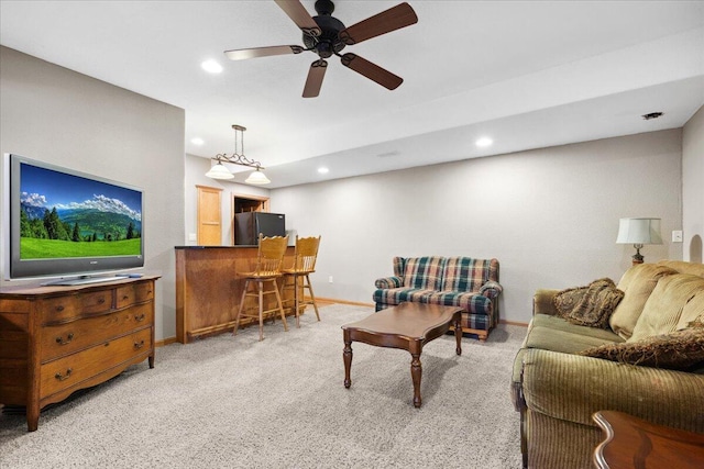 2583 Countryside Ln, Richfield, WI 53076 - living area with light carpet, baseboards, recessed lighting, ceiling fan, and bar