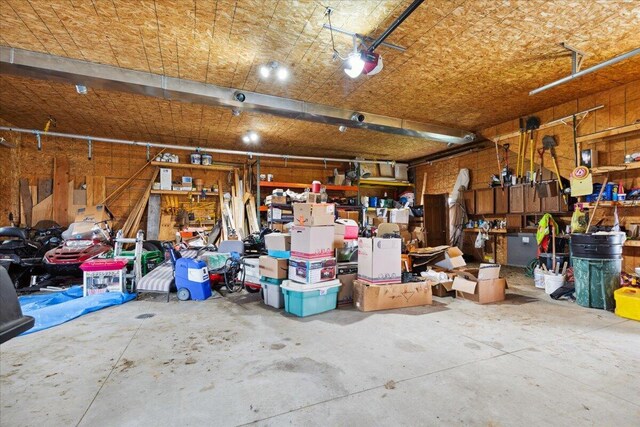 2583 Countryside Ln, Richfield, WI 53076 - garage with a garage door opener and a workshop area