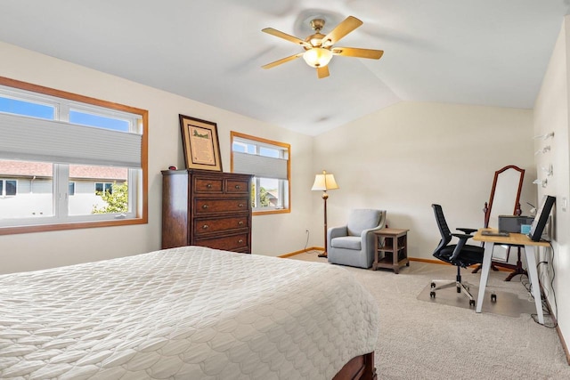 bedroom with carpet, vaulted ceiling, baseboards, and a ceiling fan