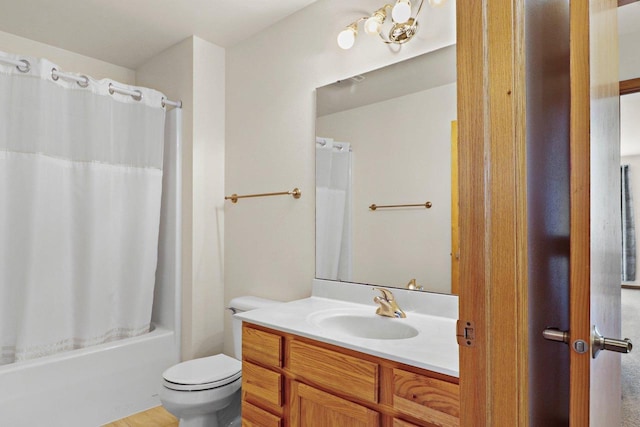 bathroom featuring toilet, vanity, and shower / bathtub combination with curtain