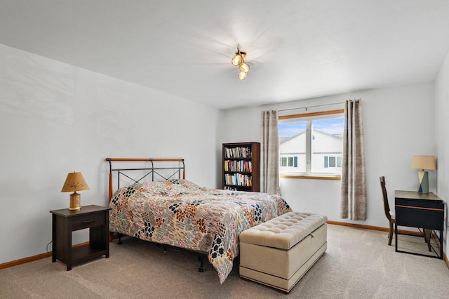 carpeted bedroom with baseboards