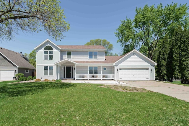 3927 Southwyck Ct, Janesville, WI 53546 - view of front of home featuring a garage, driveway, covered porch, and a front lawn