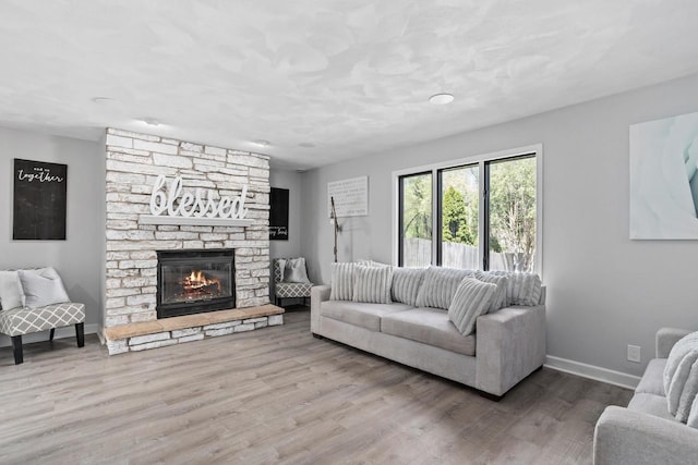 3927 Southwyck Ct, Janesville, WI 53546 - living room with wood finished floors, a fireplace, and baseboards