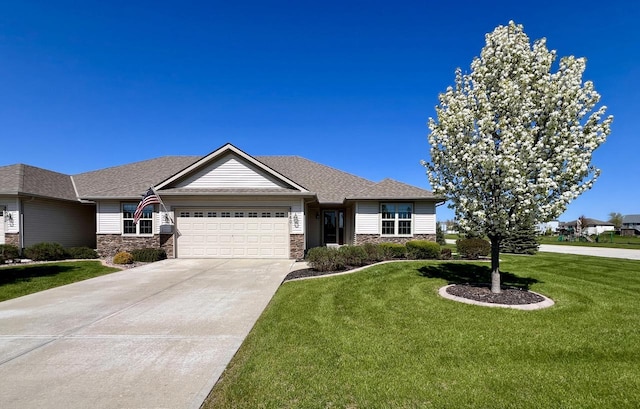 3960 Scenic Way Unit 4, Franksville, WI 53126 - view of front of property featuring an attached garage, stone siding, a front yard, and concrete driveway