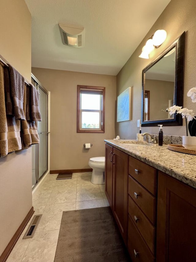 3960 Scenic Way Unit 4, Franksville, WI 53126 - full bath featuring a shower stall, toilet, vanity, tile patterned floors, and baseboards
