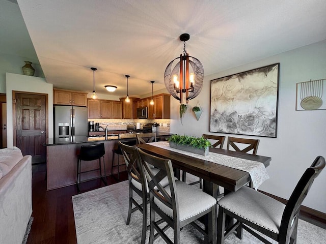 3960 Scenic Way Unit 4, Franksville, WI 53126 - dining room featuring a chandelier and wood finished floors