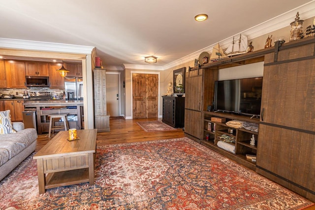 1212 Grand Ave Unit # 30, Wausau, WI 54403 - living area with ornamental molding, wood finished floors, and a barn door
