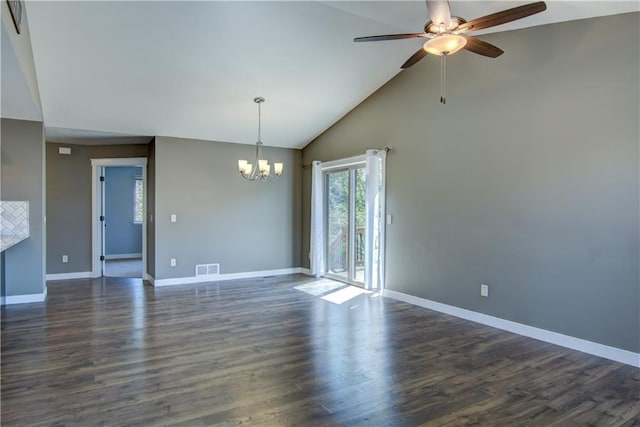 empty room featuring a chandelier, ceiling fan, baseboards, dark wood-type flooring, and high vaulted ceiling